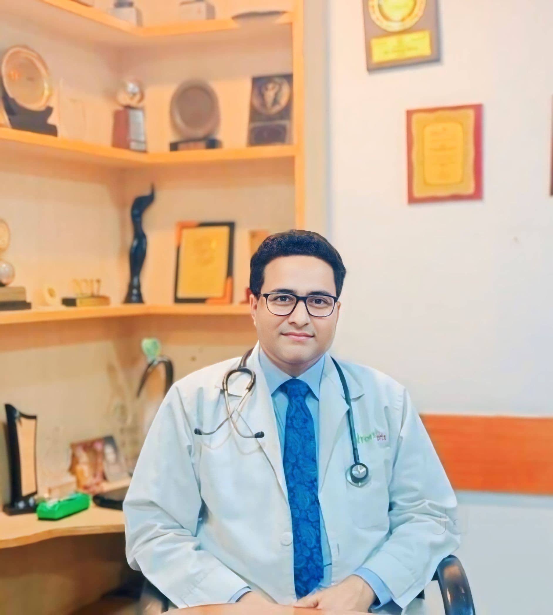 Dr. S. Hussain, physician & diabetologist in Siwan Bihar, professional clinic portrait with awards on display