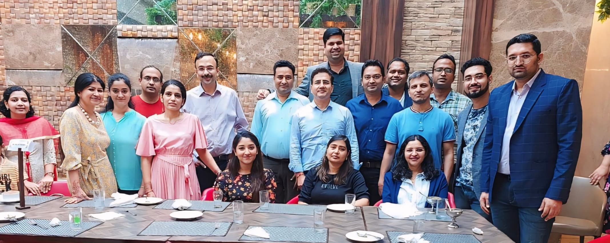 Vertical group photo of Dr. S. Hussain with physician colleagues at a medical conference dinner